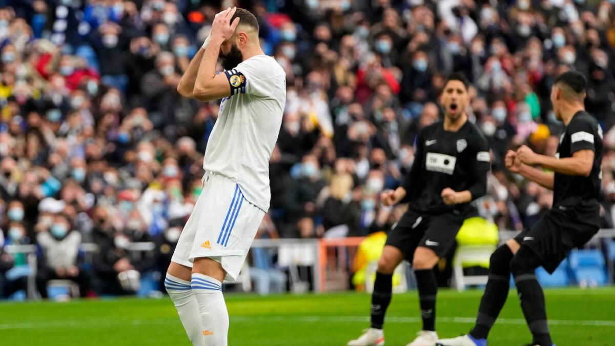 Real Madrid’s star striker Karim Benzema reacts after missing a penalty against Elche during their La Liga game on Sunday. (AP)