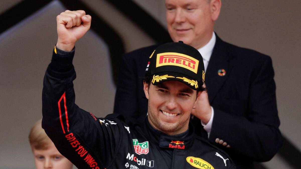 Red Bull's Sergio Perez celebrates on the podium after winning the race. (Reuters)