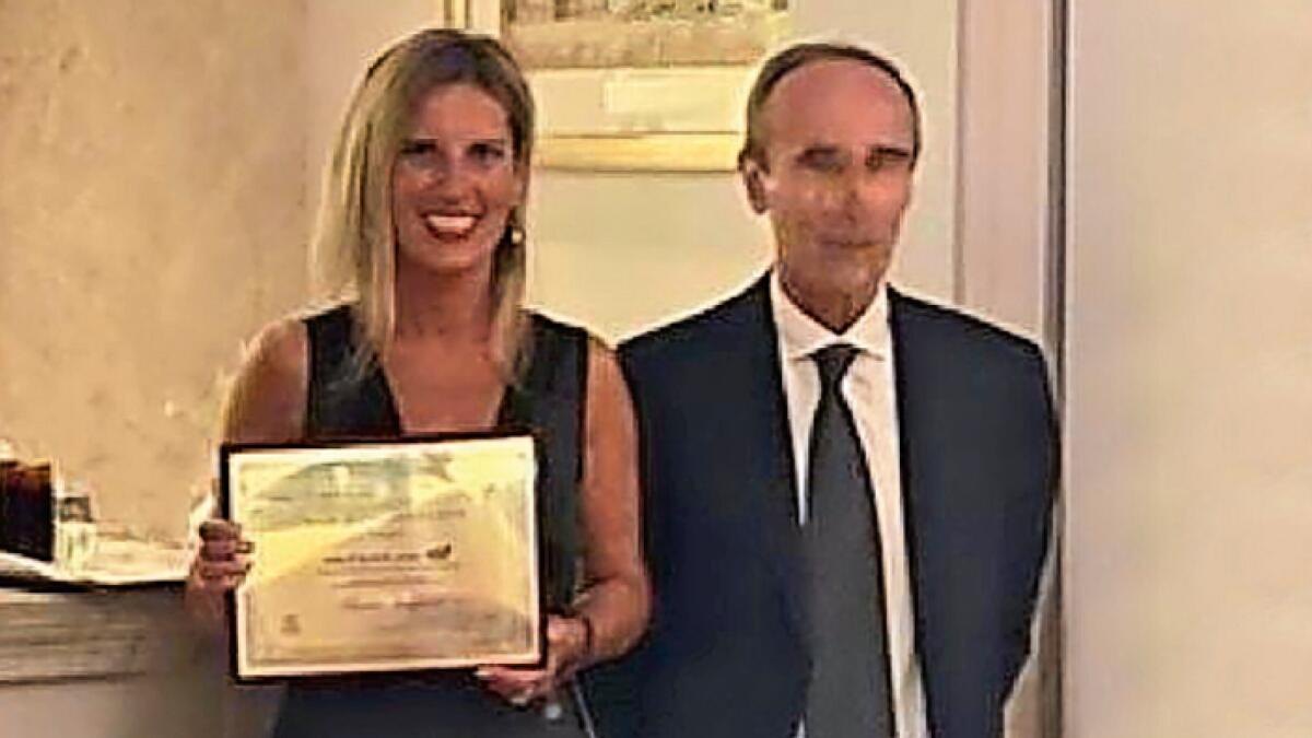 Stefano Campagna, President of Italian Chamber of Commerce in the UAE, awards lawyer Claudia Manfredi as Best Representative 2021.