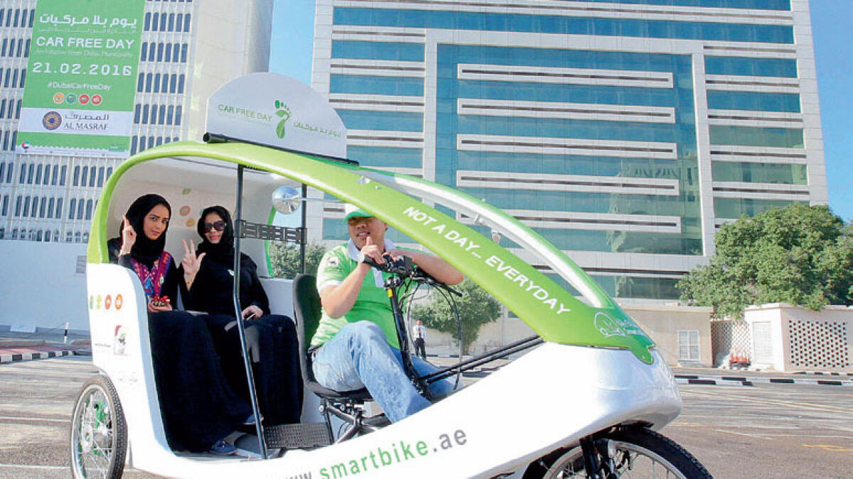 DM employees taking the smart bike to get to work on Car Free Day on Sunday.