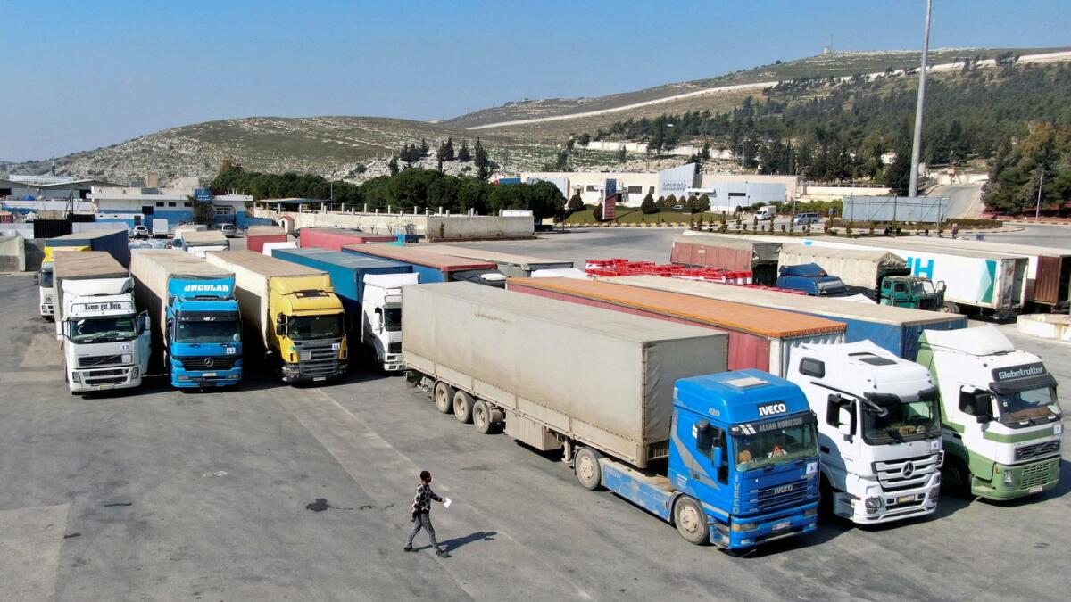 Trucks carrying aid from UN  World Food Programme (WFP) are parked at Bab Al Hawa crossing in Syria. — Reuters file
