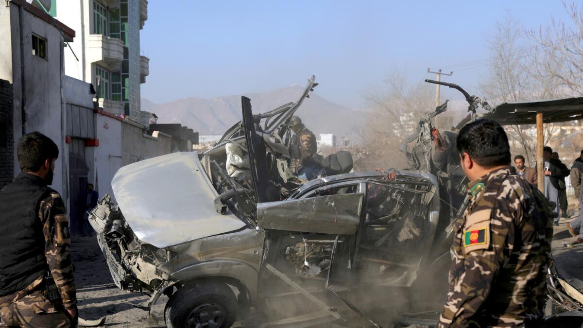 Afghan security personnel inspect the site of a bombing attack in Kabul, Afghanistan on Dec. 16, 2020. - Reuters