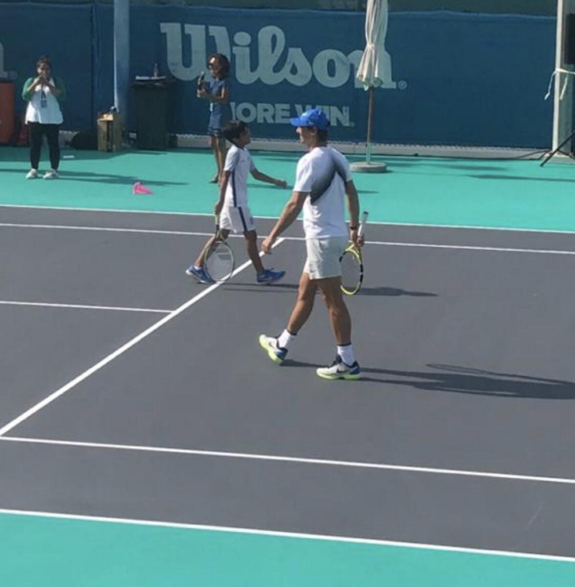 Marwan (left) on a practice court with Nadal in Abu Dhabi