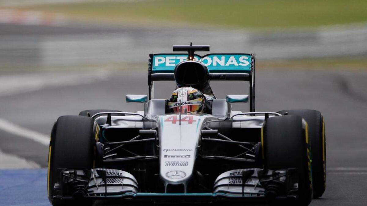 Hamilton scorches to  record Malaysia pole