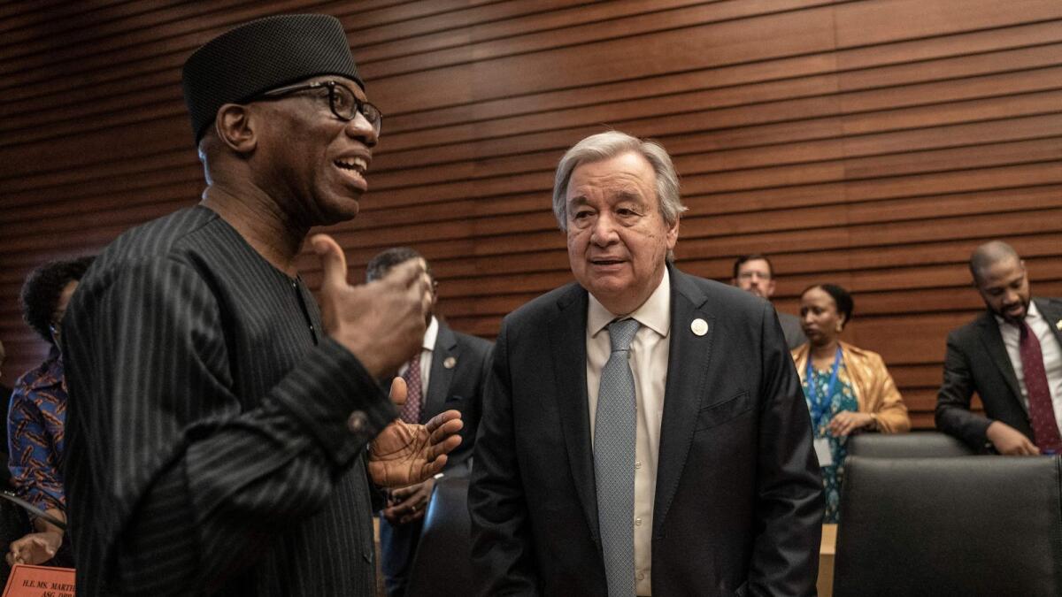 Bankole Adeoye (left), African Union (AU) Commissioner for political affairs, peace and security, speaks with Antonio Guterres, United Nations (UN) Secretary-General, during a bilateral meeting at the Africa Union headquarters in Addis Ababa, Ethiopia, on  Saturday. - AFP
