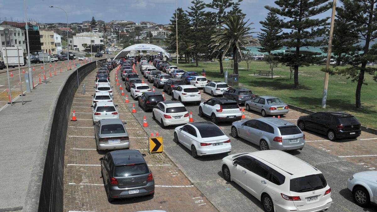 Residents queue up inside their cars for PCR tests at the St Vincent's Bondi Beach COVID-19 drive through testing clinic on December 22, 2021 in Sydney. Photo: AFP
