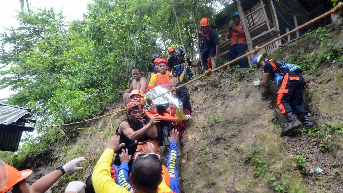 Massive landslide kills 21 and buries houses in Philippines