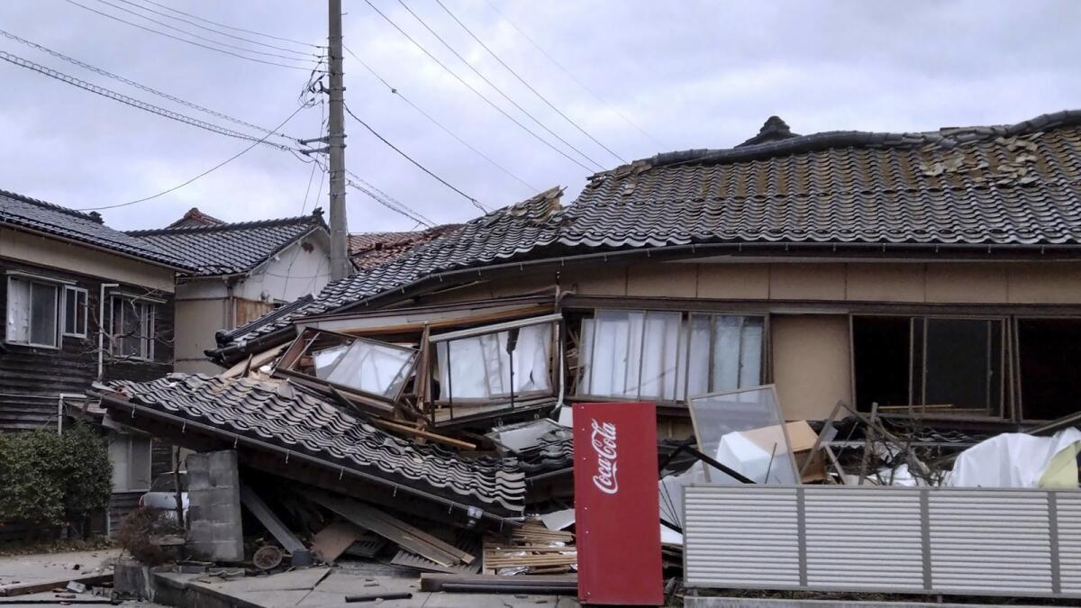 A house is damaged by an earthquake in Wajima. — AP