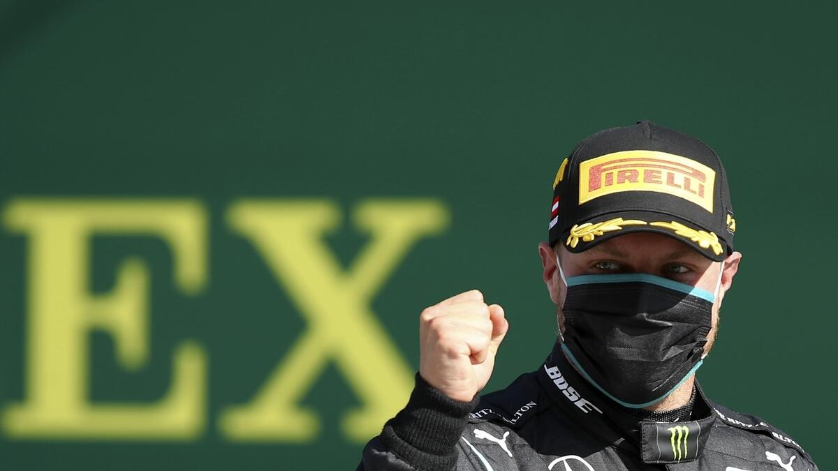 Mercedes driver Valtteri Bottas celebrates after winning the Austrian Formula One Grand Prix. (AP)