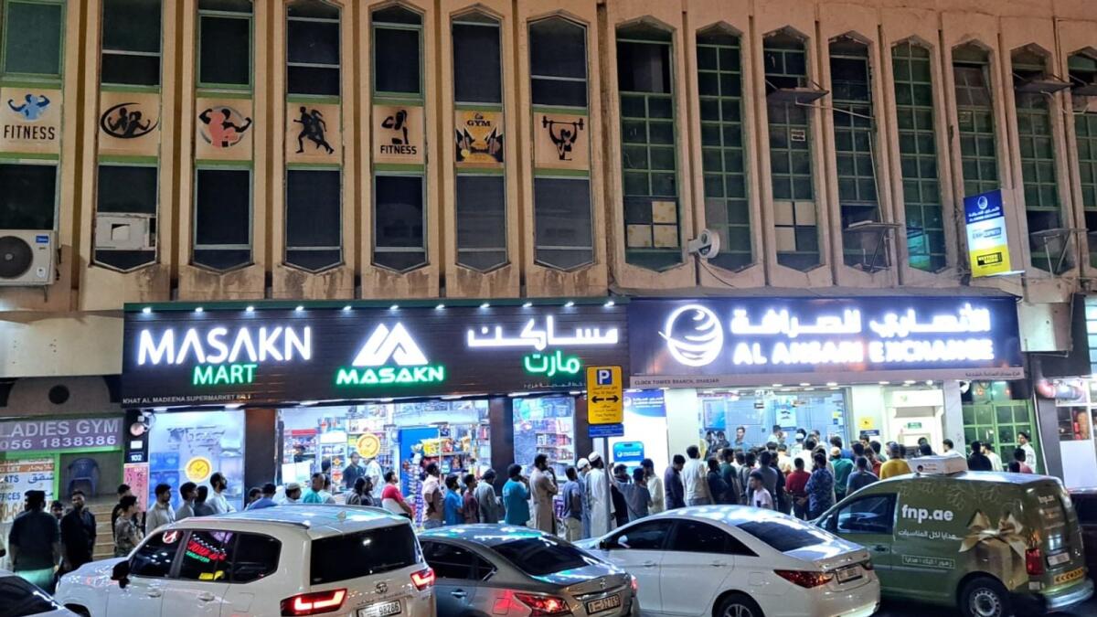 Employees' rush at Rolla's Al Ansari Exchange to register for job loss insurance scheme on Saturday. — Photo by a KT reader