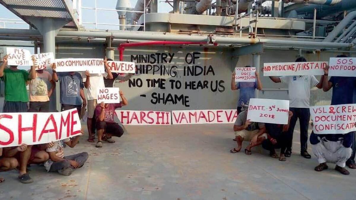 Seamen with placards carrying messages seeking action.- Supplied photo 