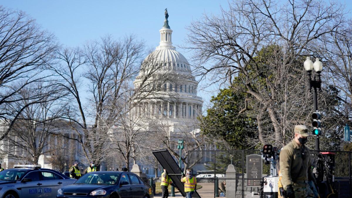 Workers install no-scale fencing around the US Capitol in Washington on Thursday. Photo: AP