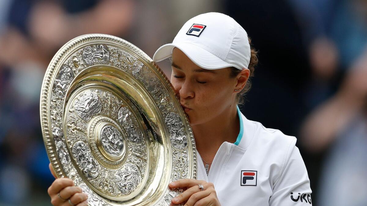 Australia's Ashleigh Barty poses with the trophy after winning the Wimbledon final on July 10, 2021. (AP)
