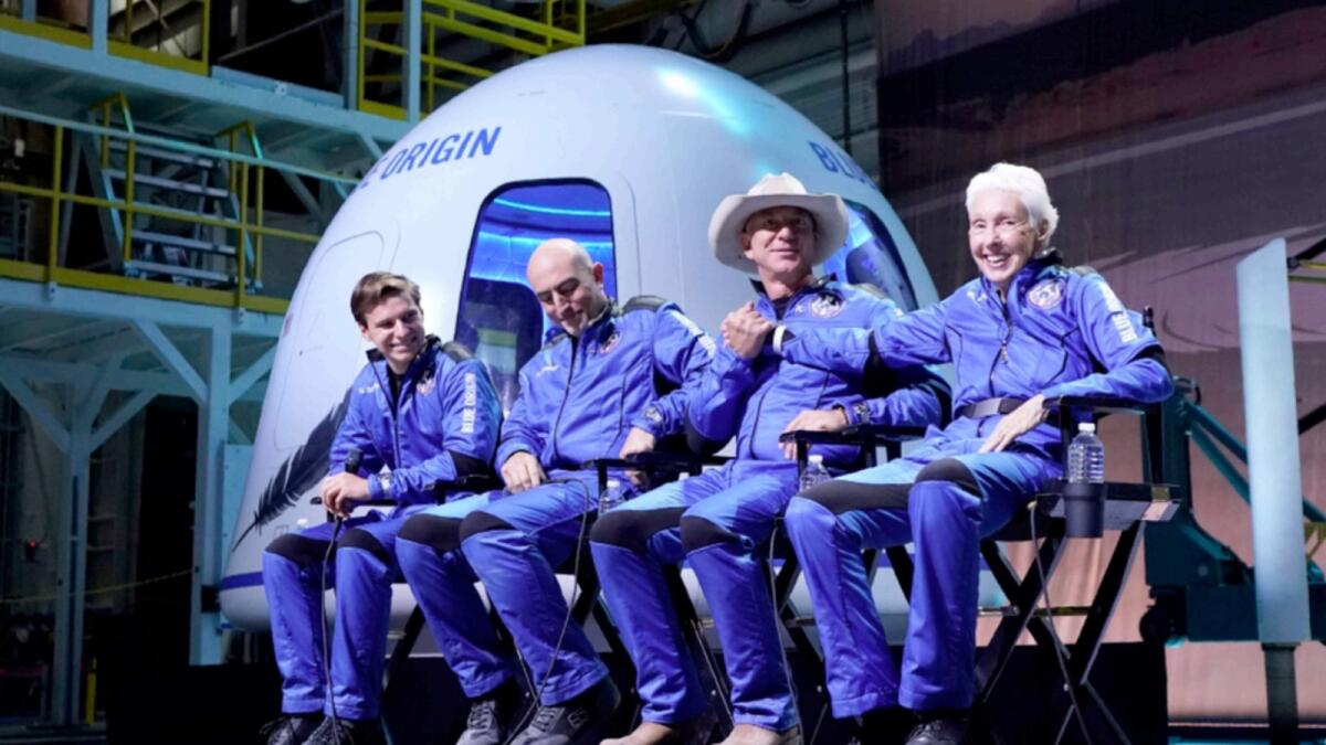 Oliver Daemen, Mark Bezos, Jeff Bezos and Wally Funk participate in a post launch briefing where they discussed their flight experience aboard the Blue Origin New Shepard rocket at its spaceport near Van Horn, Texas. — AP file