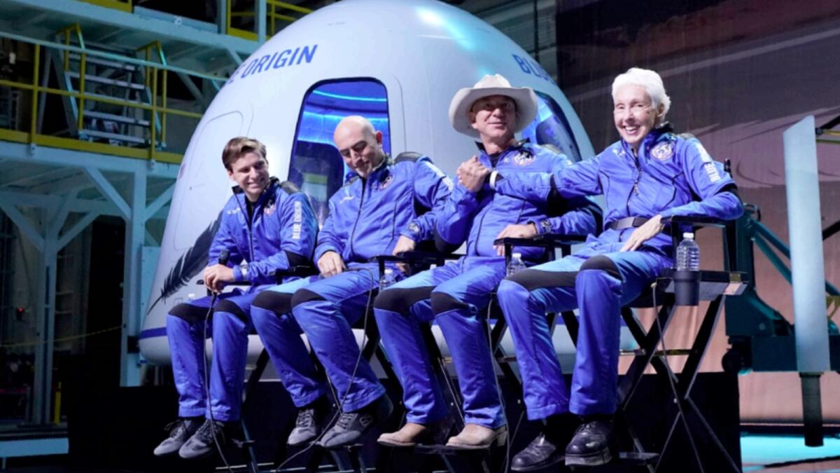 Oliver Daemen, Mark Bezos, Jeff Bezos and Wally Funk participate in a post launch briefing where they discussed their flight experience aboard the Blue Origin New Shepard rocket at its spaceport near Van Horn, Texas. — AP file