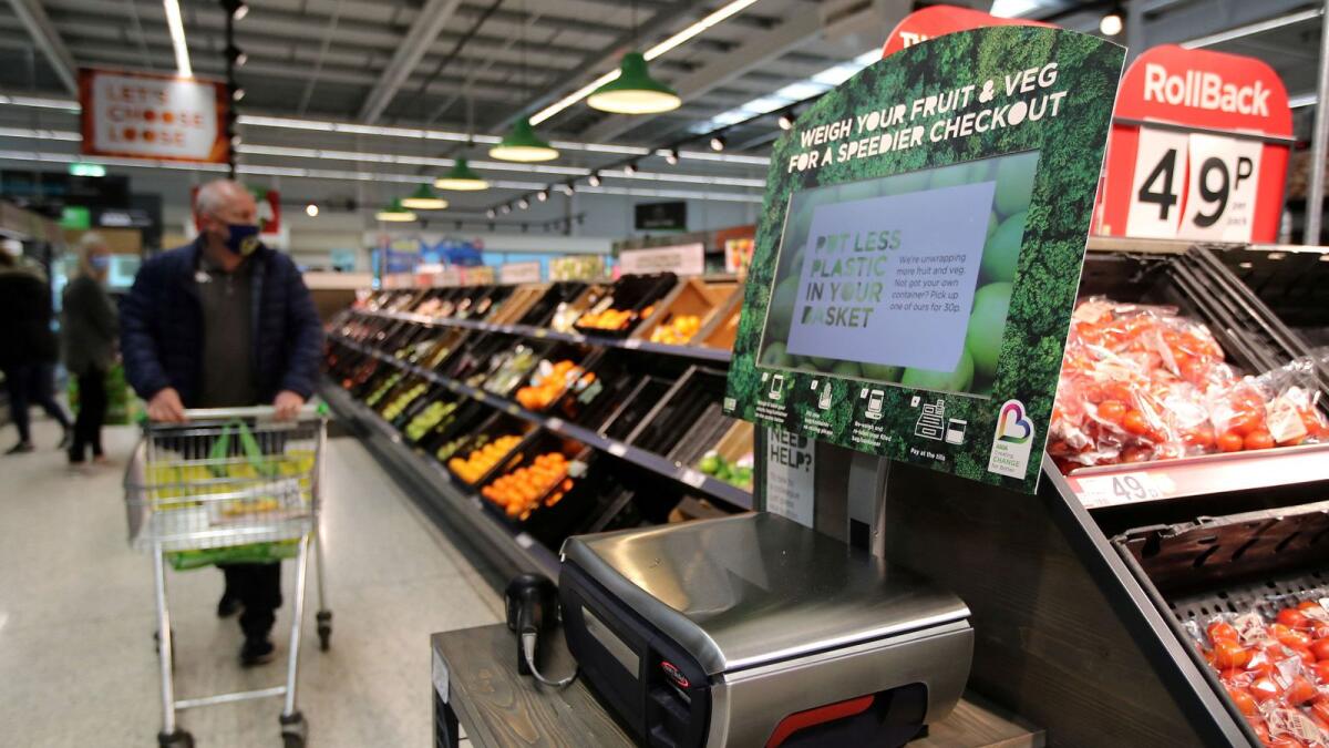 FILE PHOTO: Scales to weigh loose fresh produce are seen in the UK supermarket Asda, as the store launches a new sustainability strategy, in Leeds, Britain, October 19, 2020.  — Reuters file