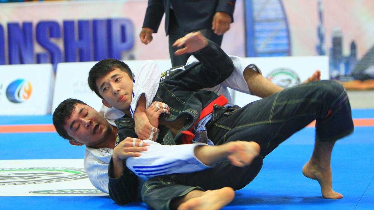 Berik Suleimenov of Kazakhstan grapples with Mansur Khabibulla of Kazakhstan during the Dubai International Jiu-Jitsu Open Championship on Saturday.  