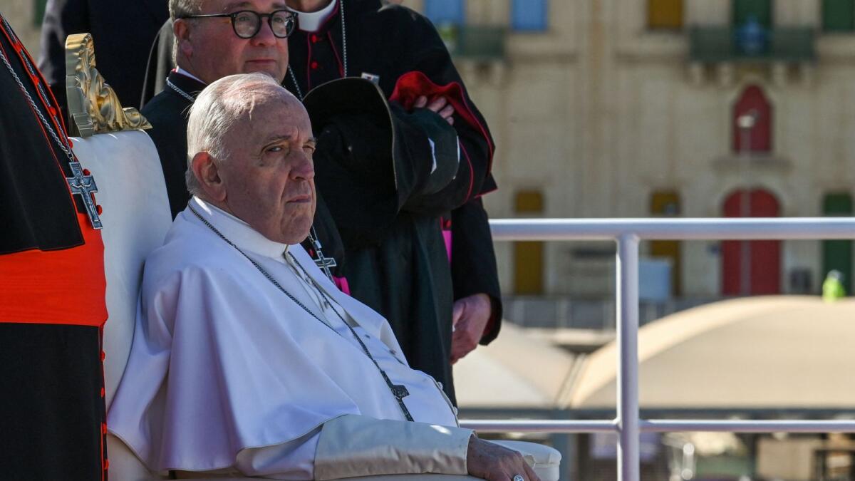 Pope Francis sits aboard a ferry-boat leaving Valletta's port en route to the island of Gozo, on the first day of his two-day trip to Malta. –AFP