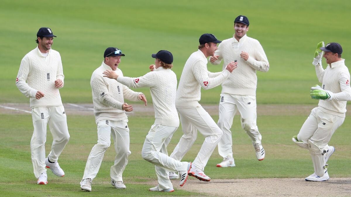 England's Dom Bess celebrates the wicket of West Indies' Roston Chase with teammates during the fifth and final day of the third Test match on Tuesday. - Reuters