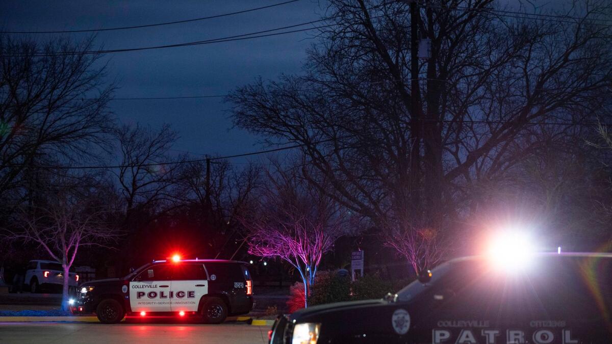 Police cars remain parked at Good Shepherd Catholic Community church on January 15, 2022 in Colleyville, Texas. Photo: AFP