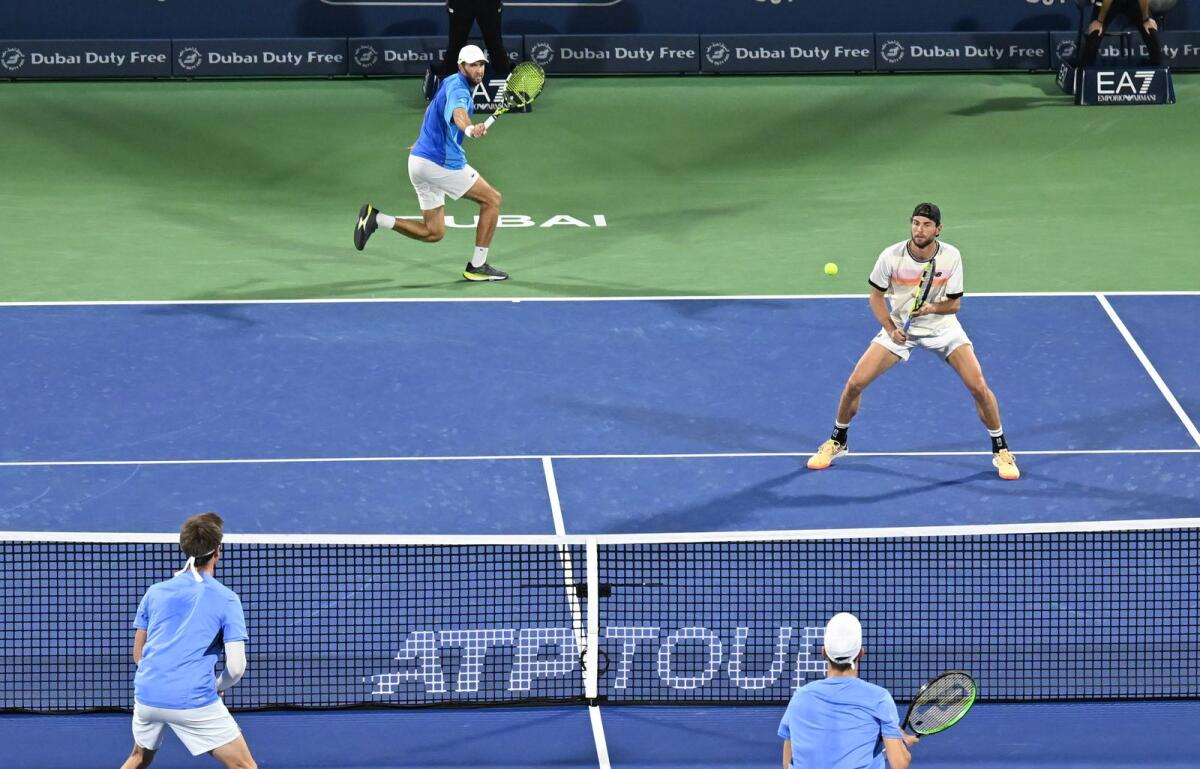 Maxime Cressy of the US and Fabrice Martin of France in action against Belgium's Sander Gille and Joran Vliegen. — M.Sajjad/Khaleej Times