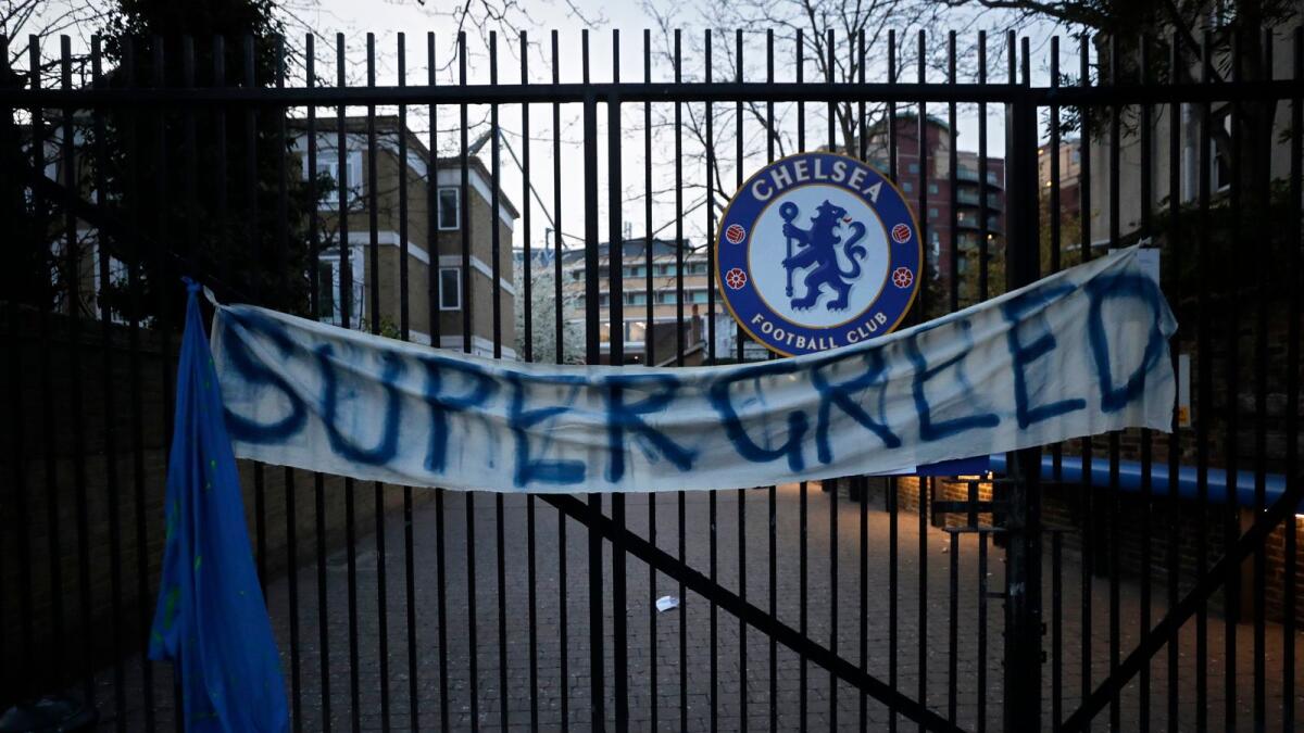 A banner hangs from one of the gates of Stamford Bridge stadium in London where Chelsea fans were protesting against Chelsea's decision to be included amongst the clubs attempting to form a new European Super League. — AP