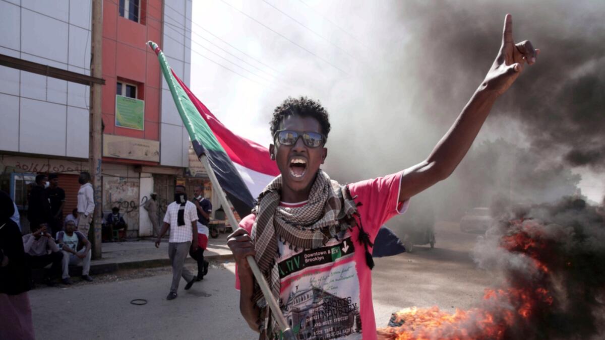 A man chants slogans during a protest to denounce the October military coup, in Khartoum. — AP