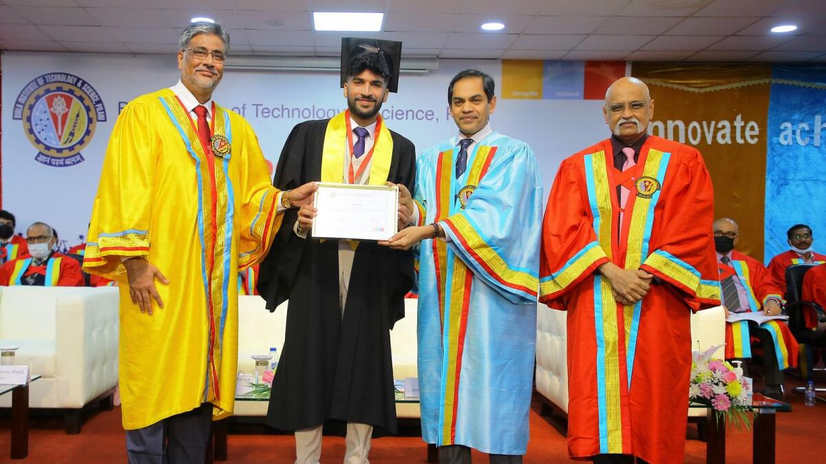 Ritik Panda receiving the Chancellor's Medal (Gold) from Sunjay Sudhir, Ambassador of India to the UAE, together with Prof Souvik Bhattacharayya, Vice Chancellor of BITS Pilani and Prof Srinivasan Madapusi, Director, BITS Pilani, Dubai Campus