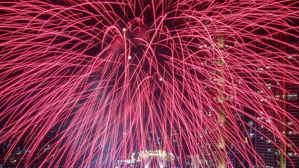 Fireworks explode over Chao Phraya River during the New Year celebrations amid the spread of the coronavirus disease (COVID-19) in Bangkok, Thailand, January 1, 2021.