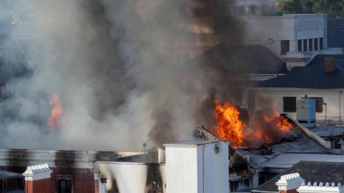 Flames engulf a building at South Africa's Parliament in Cape Town. — AP