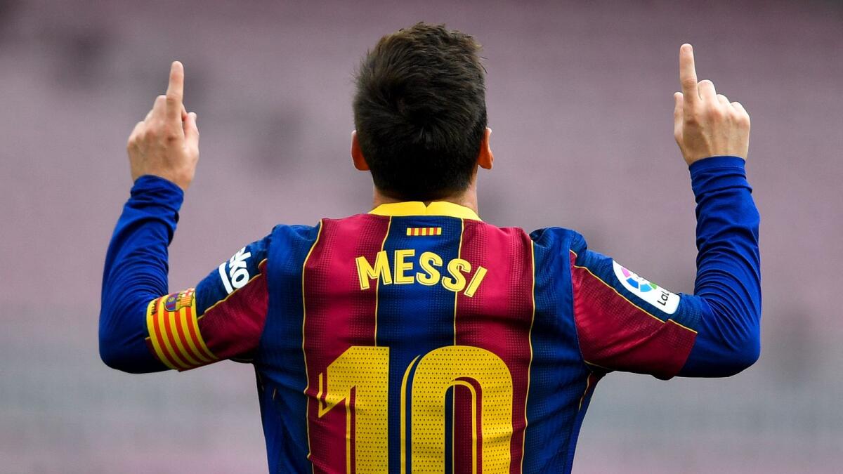Barcelona's Lionel Messi celebrates after scoring a goal against Celta Vigo at the Camp Nou on May 16. (AFP)