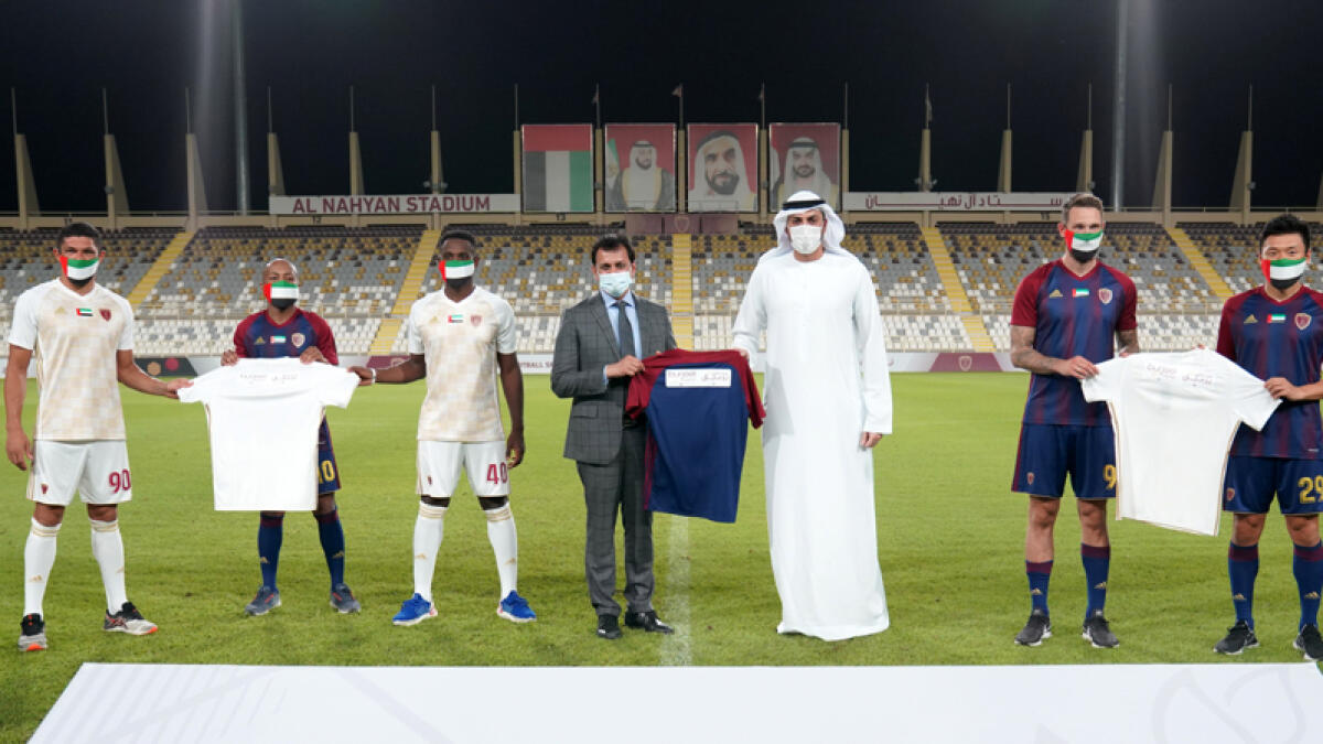 Khalid Al Hanaei, Group CEO of Al Wahda Club and John Sunil, CEO of Burjeel Hospitals along with Al Wadha team memebers after the signing ceremony. - Supplied photo