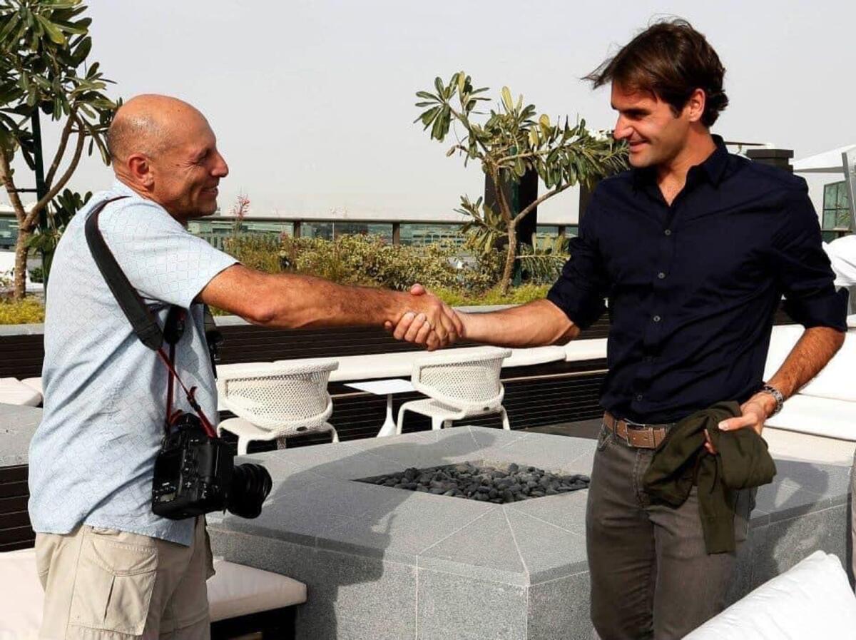 Jorge Ferrari shakes hands with Roger Federer. (Supplied photo)