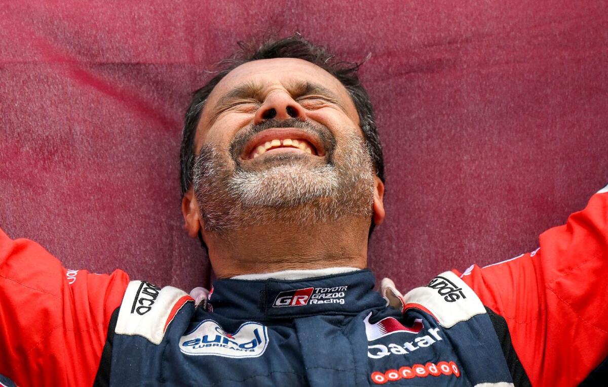 Toyota driver Nasser al-Attiyah of Qatar celebrates after winning the Dakar Rally. — AFP