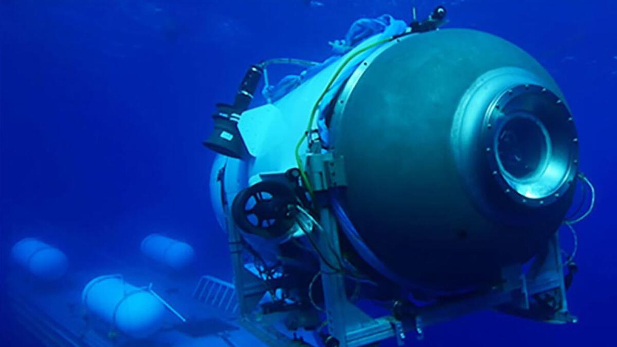 This undated image courtesy of OceanGate Expeditions, shows their Titan submersible launching from a platform. - AFP