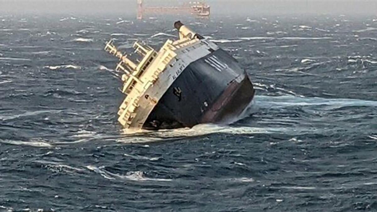 A handout picture provided by the Ports and Maritime Organization of Iran on March 17 reportedly shows an Emirati cargo ship sinking in southern Iran.
