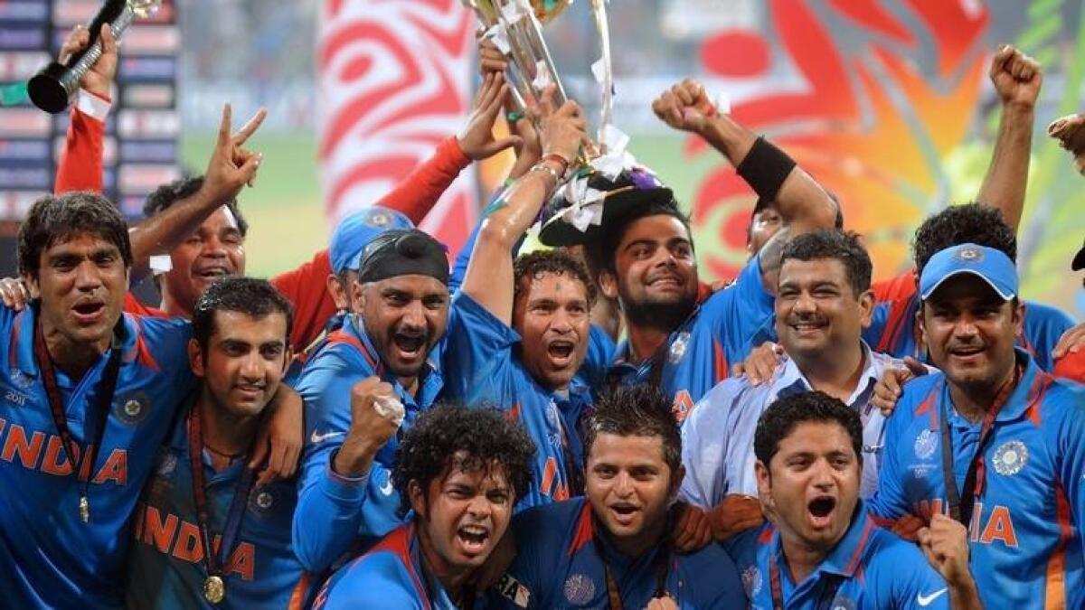 The Indian team celebrate after winning the 2011 World Cup at the Wankhede Stadium in Mumbai. - AFP file