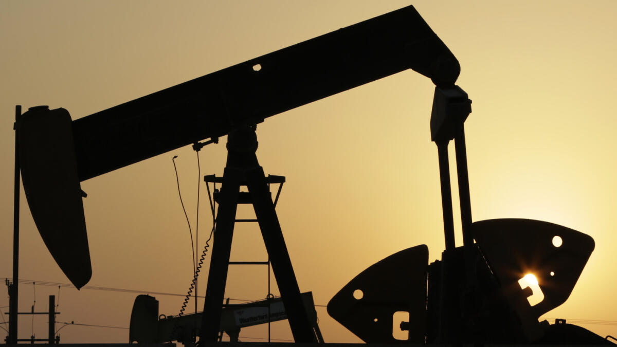 Oil pumps work in the desert oil fields of Sakhir, Bahrain.— AP file