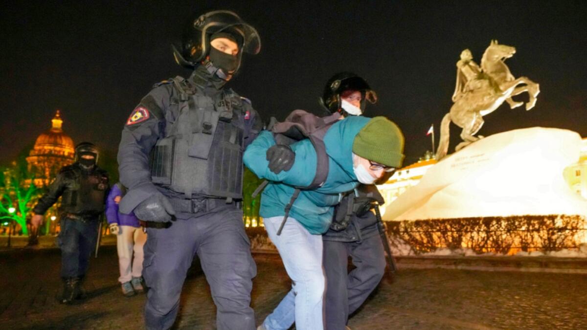 Police detain demonstrators during an action against Ukraine conflict in St. Petersburg. — AP