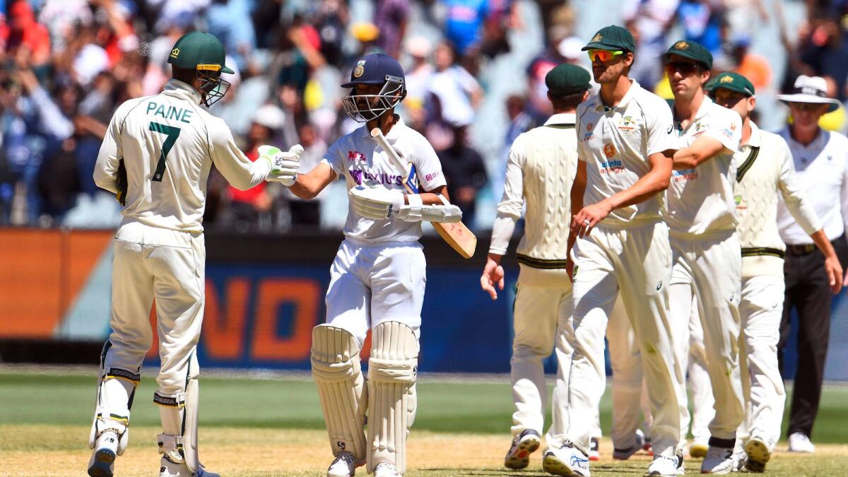 India's captain Ajinkya Rahane (second left) fist bumps Australia's captain Tim Paine at the end of the second Test at the MCG. (AFP)