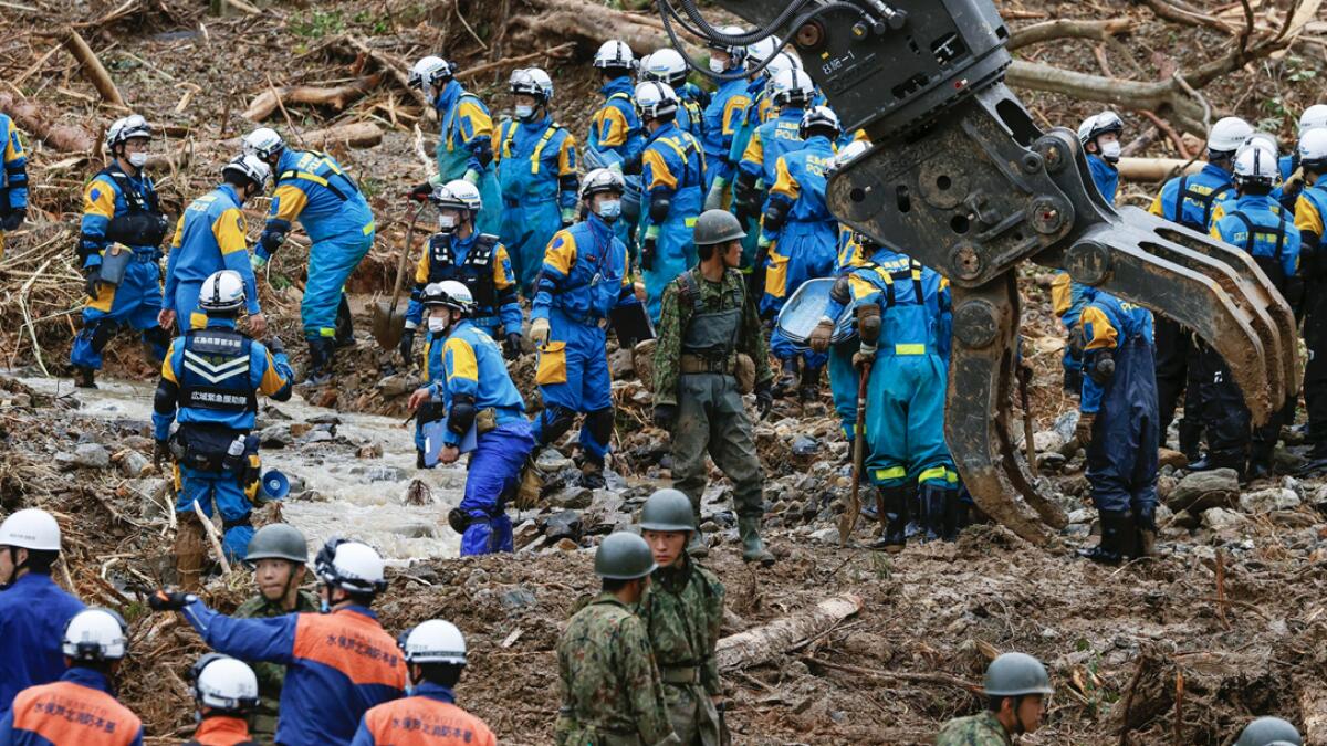 Rescuers search for missing persons at the site of a landslide in Tsunagi town, Kumamoto prefecture, southern Japan. Photo: AP
