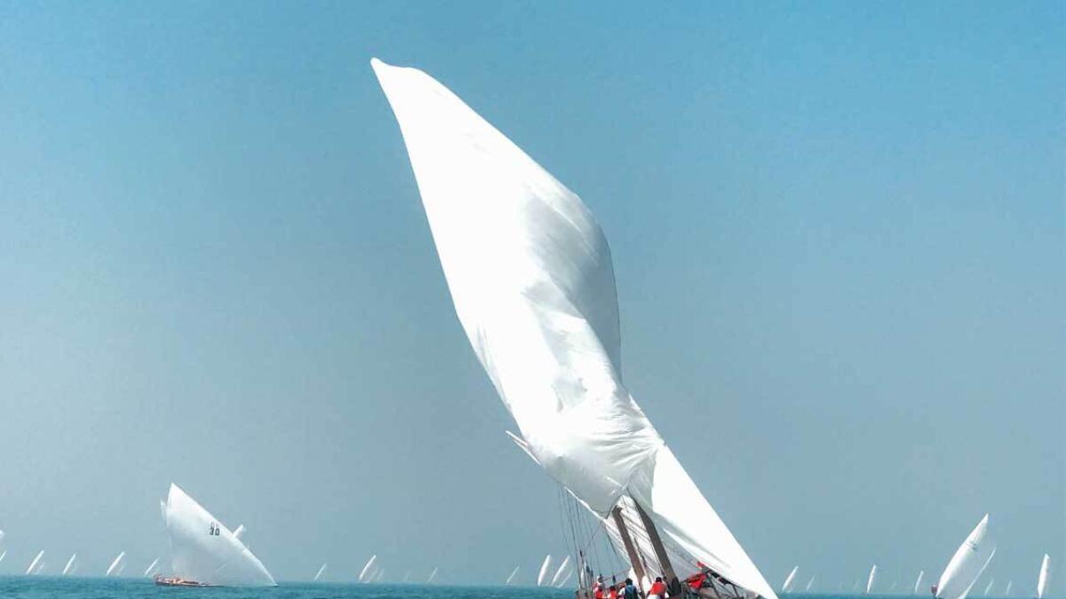 Another shot by Al Rais shows a dhow in full sail against the backdrop of other vessels, at the Traditional Dhow sailing race.