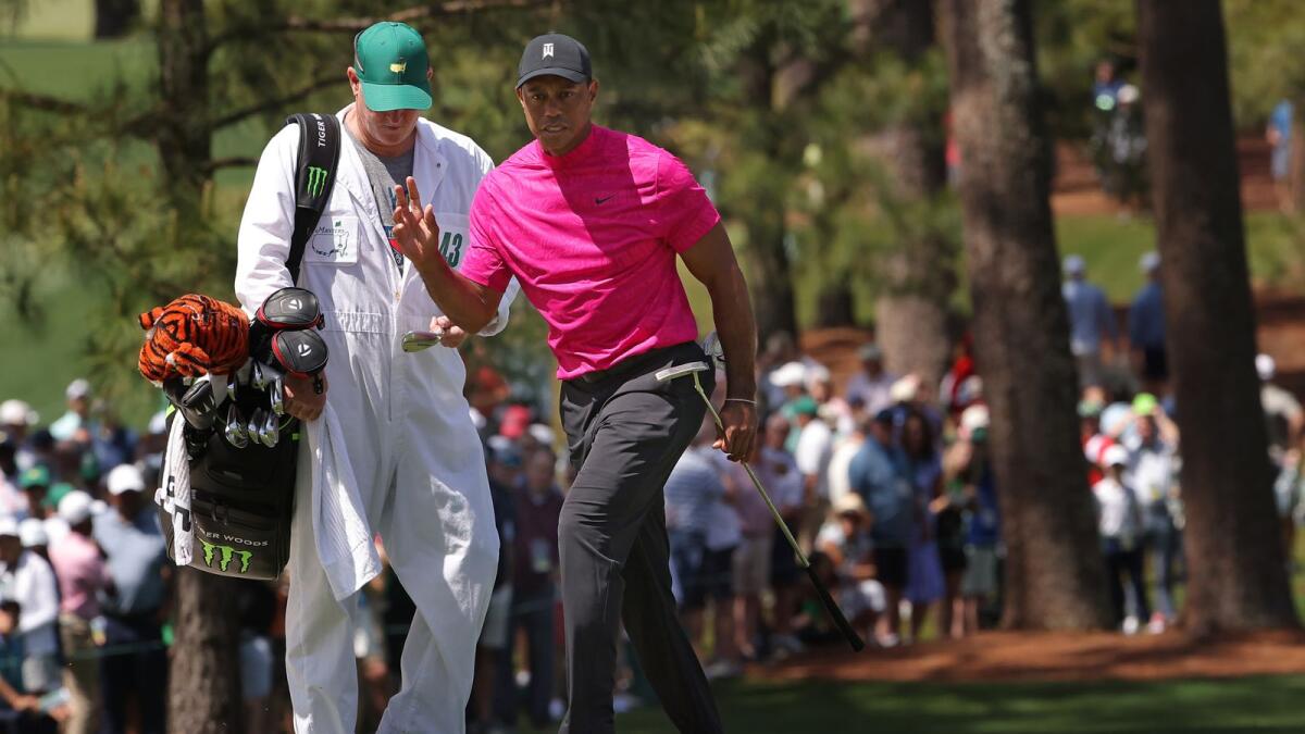Tiger Woods reacts after making par on the seventh green during the first round of the Masters at Augusta National Golf Club. (AFP)