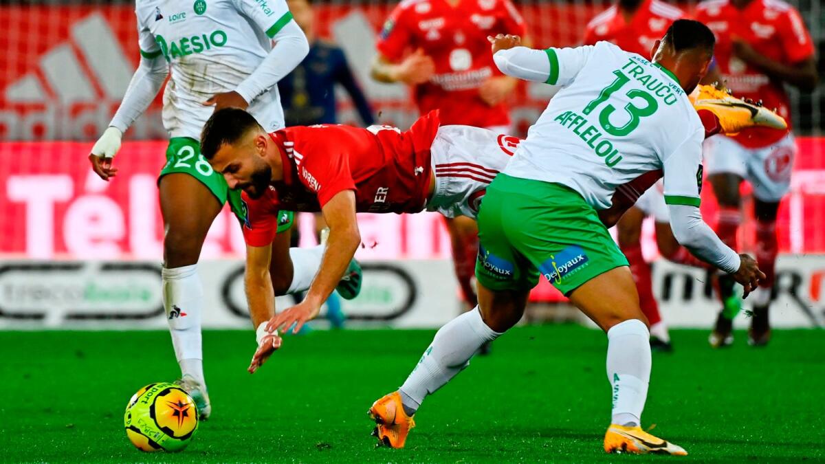 Brest's French forward Franck Honorat (centre) is tackled by Saint-Etienne's defender Miguel Angel Trauco Saavedra. — AFP