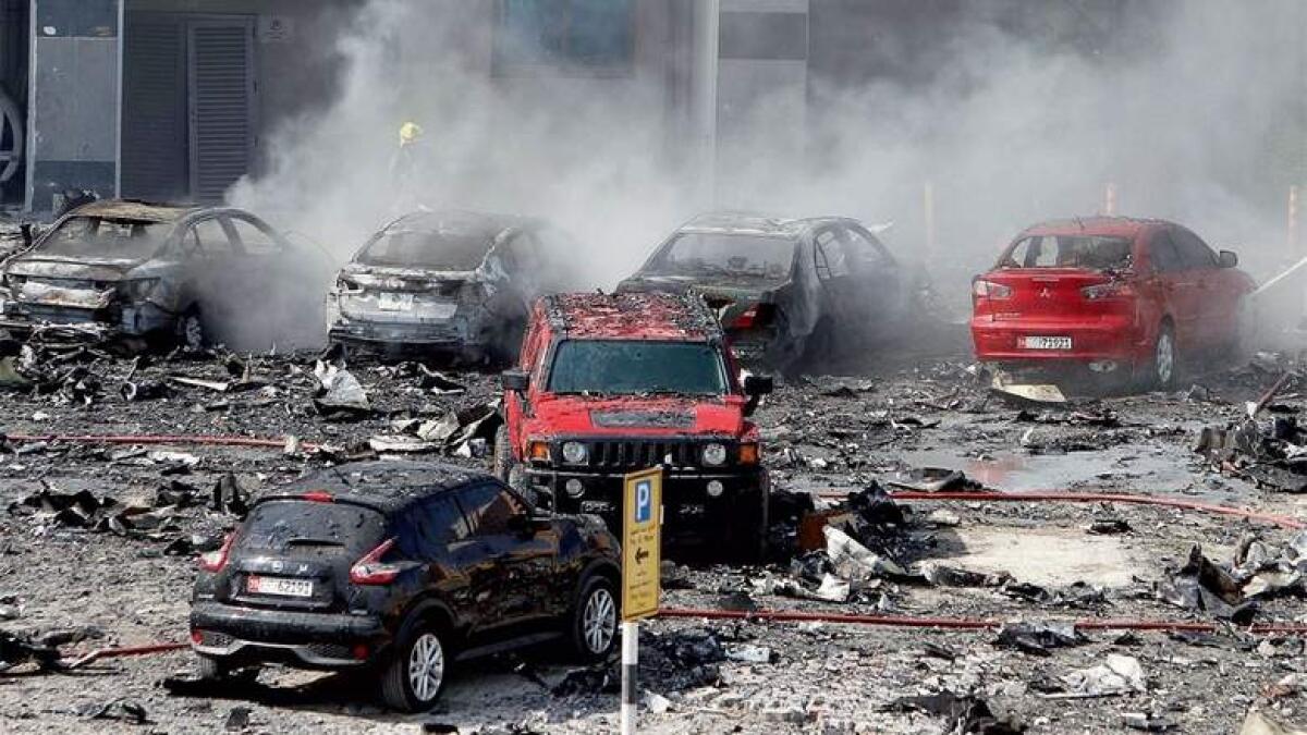 Fourteen cars, all on the sixth level of parking, were destroyed in the fire. (Photo by M. Sajjad)