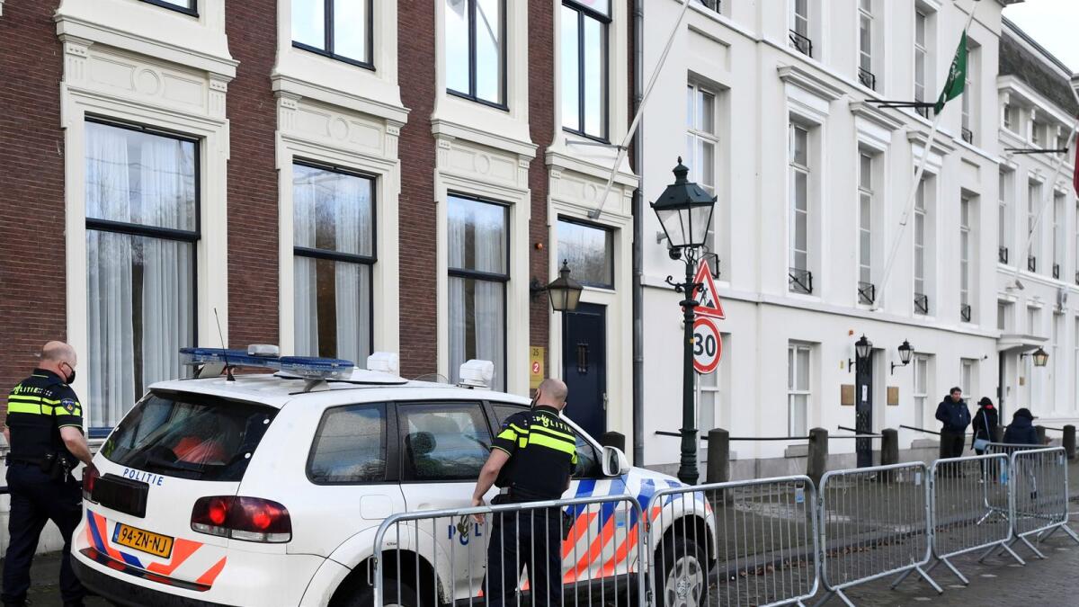 Police officers stand near the Embassy of Saudi Arabia after unidentified assailants sprayed it with gunfire, in The Hague, Netherlands November 12, 2020.
