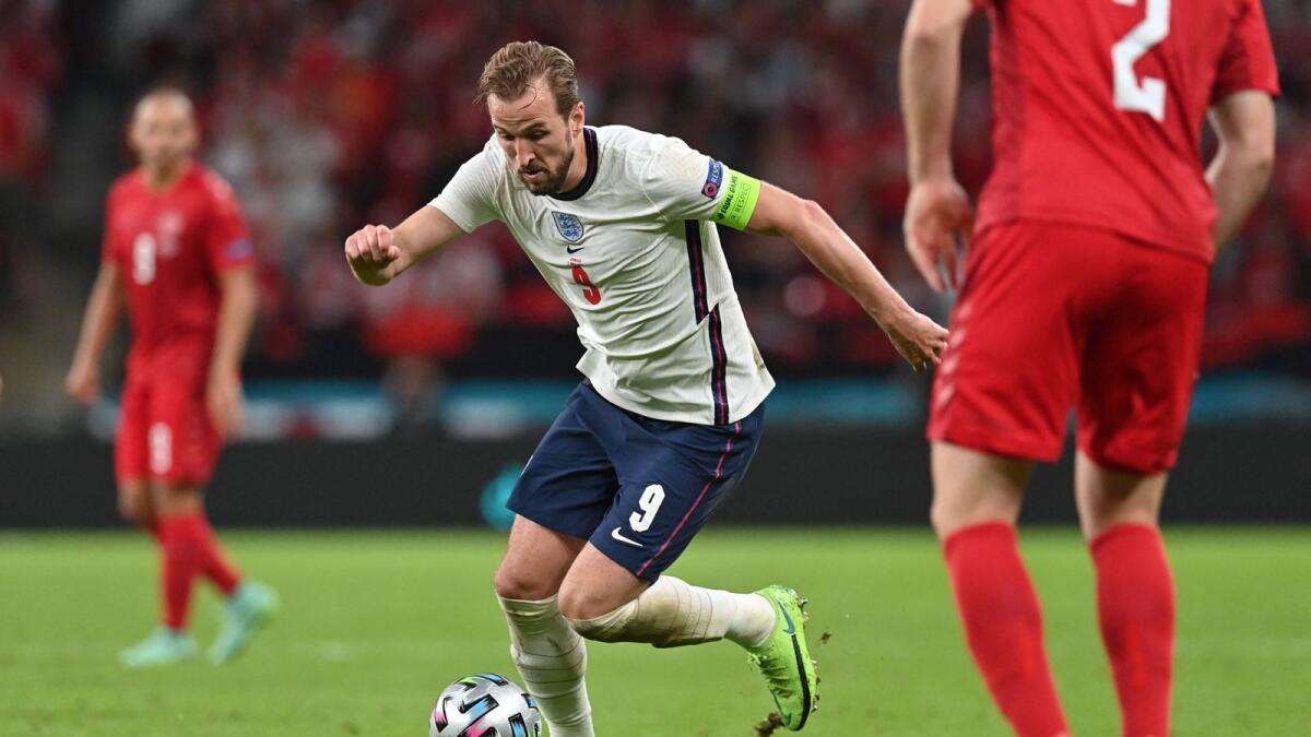 England's forward Harry Kane runs with the ball during the Euro 2020 semifinal between England and Denmark at Wembley Stadium. — AFP