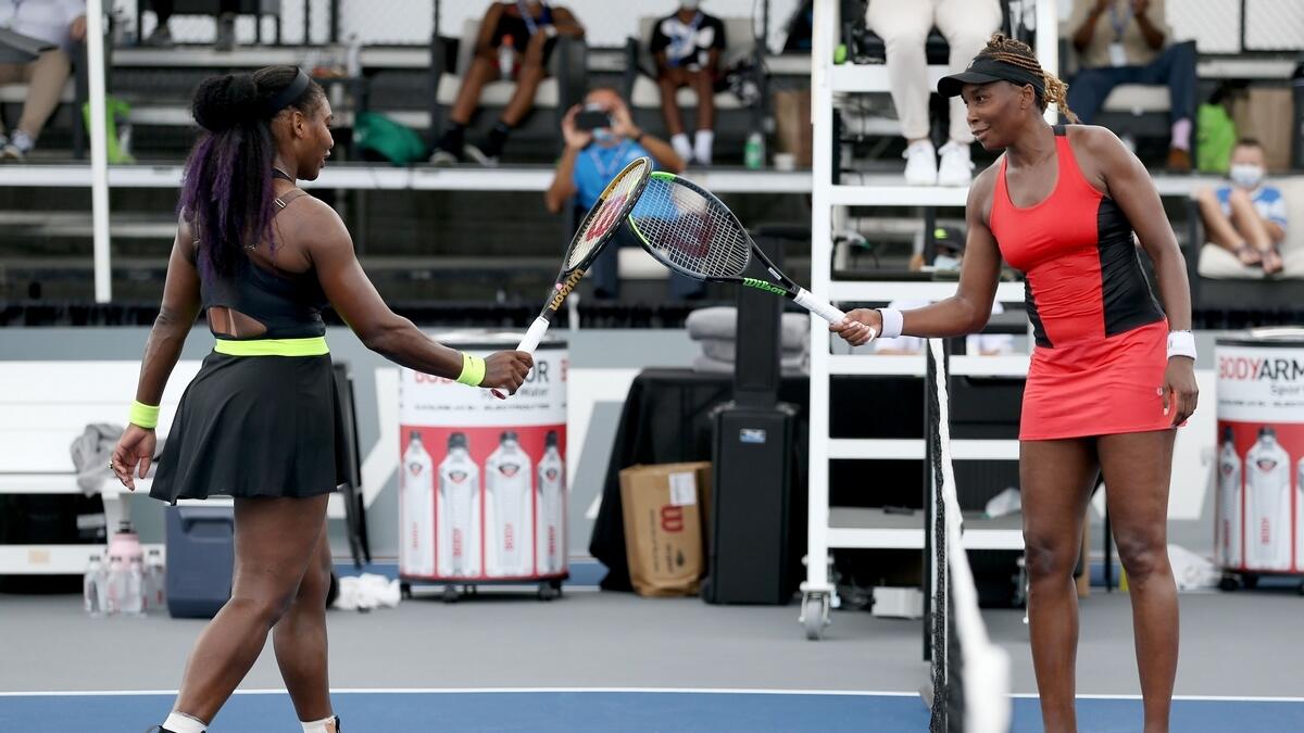Serena Williams (left) and Venus Williams after their match on Thursday. (Reuters)