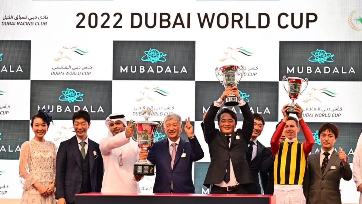 Owners of horse Crown Pride and jockey Damian Lane pose with trophy during the presentation of UAE Derby race of Dubai Word Cup at Meydan on Saturday, March 26. Photo by Neeraj Murali