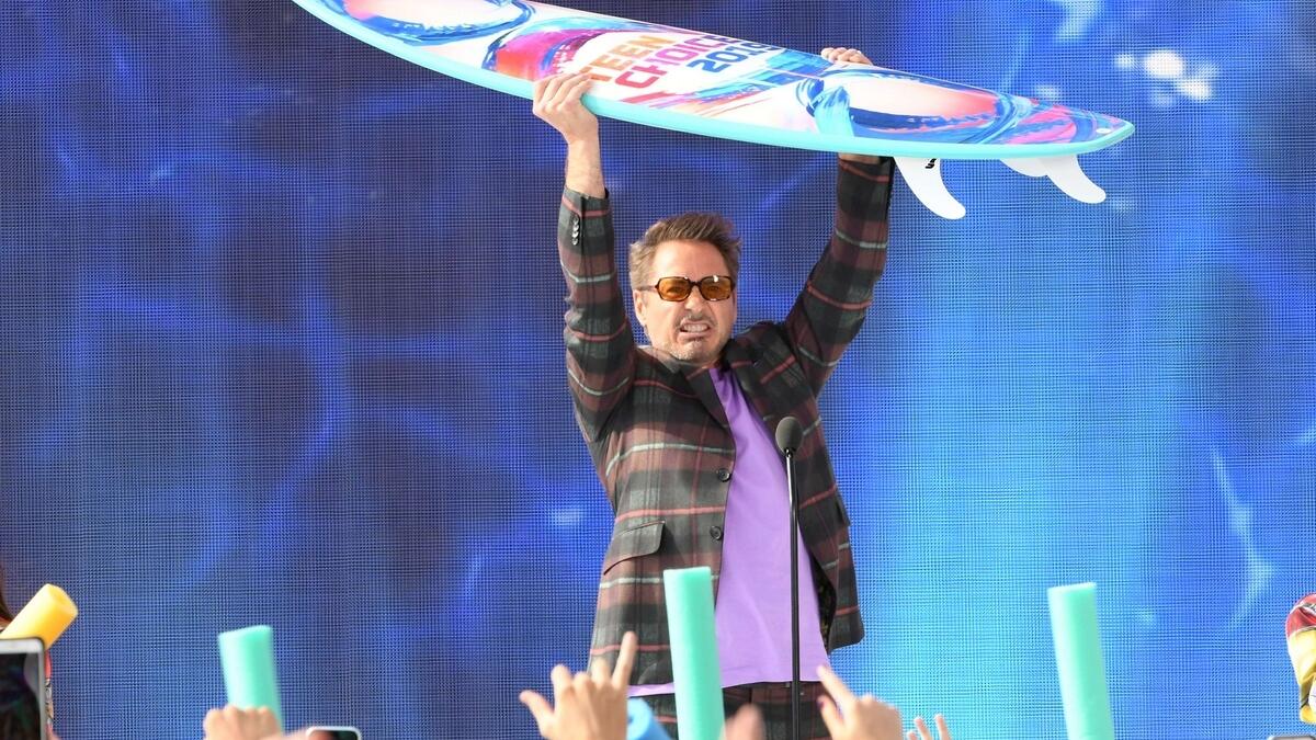 Robert Downey Jr. flaunts his Choice Action Movie Actor award for Avengers: Endgame. AFP